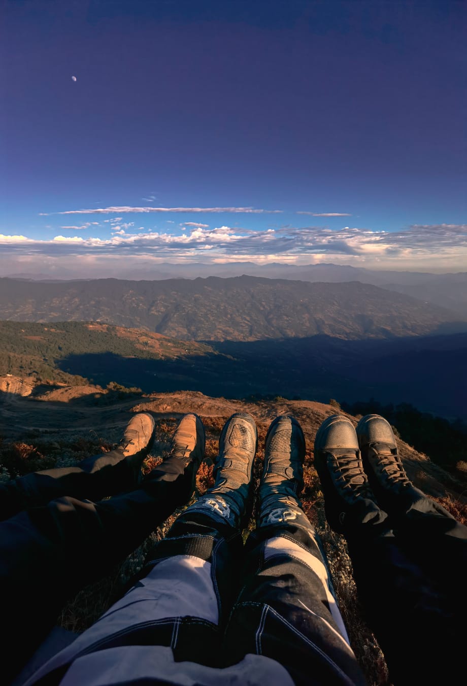 Rider silhouetted at sunset in the Nepali hills